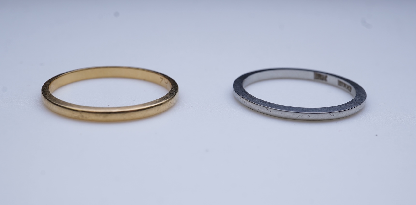 A diamond ring and two gold wedding rings
